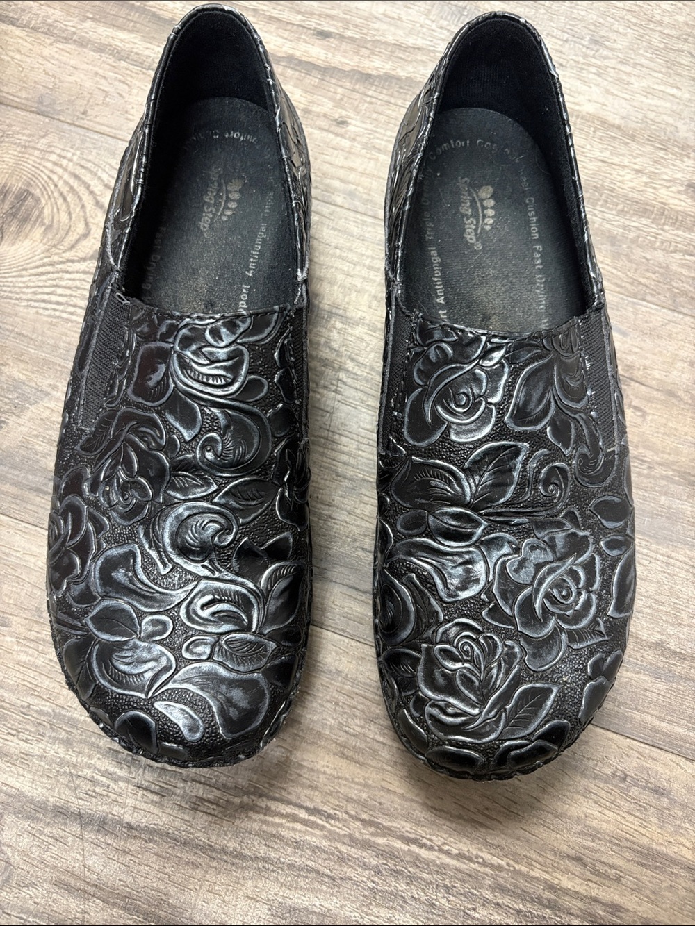 Spring Step Black Embossed Floral Slip-Ons